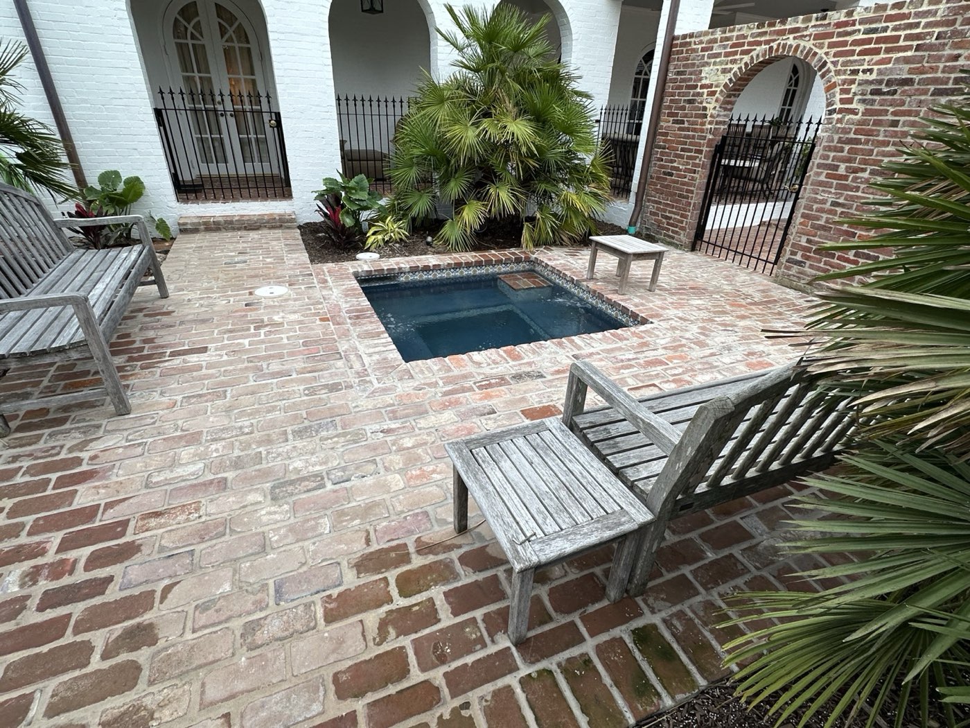 Courtyard plunge pool with brick patio surround